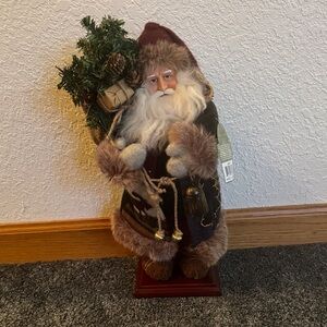 Holiday Santa Figurine with Greenery
